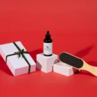 A bottle of Maundy's callus remover and a paddle with a gift box