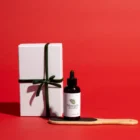 A bottle of Maundy's callus remover and a paddle with a gift box