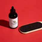 A bottle of Maundy's callus remover and a paddle