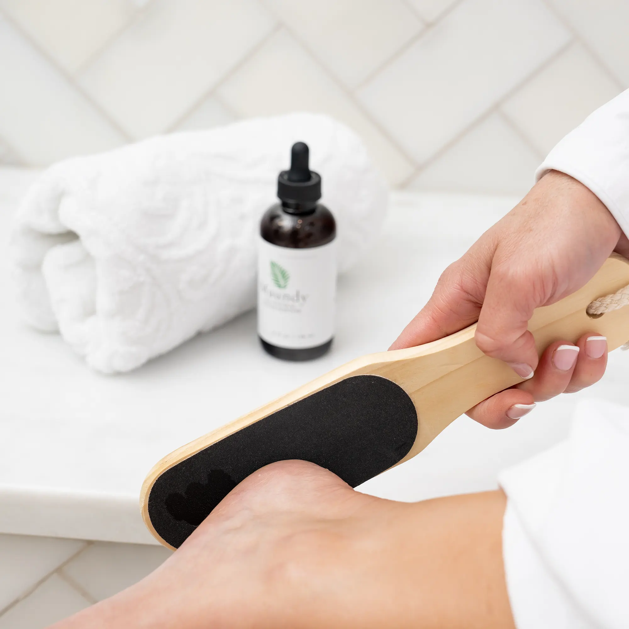 Linda using the paddle with Maundy’s All-Natural Callus Remover