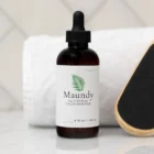 Maundy’s All-Natural Callus Remover bottle and a paddle over a towel